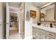 Bathroom featuring a vanity with a sink, adjacent glass shower, and doorway into another room at 820 Kenmore Rd, Chapel Hill, NC 27514