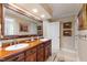 Elegant bathroom featuring a double sink vanity, and a beautifully decorated mirror at 820 Kenmore Rd, Chapel Hill, NC 27514