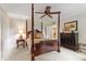 Spacious bedroom with dark wood furniture, a four-poster bed, and soft carpet flooring at 820 Kenmore Rd, Chapel Hill, NC 27514