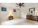 Minimalist bedroom with dark wood dressers, accent lamps, neutral walls, and large open space at 820 Kenmore Rd, Chapel Hill, NC 27514