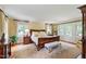 Comfortable bedroom with ample natural light, complemented by hardwood floors and neutral tones at 820 Kenmore Rd, Chapel Hill, NC 27514
