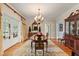 Formal dining area boasting hardwood floors, chandelier, and an inviting atmosphere at 820 Kenmore Rd, Chapel Hill, NC 27514