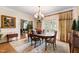 Elegant dining room featuring hardwood floors, chandelier lighting, and classic design at 820 Kenmore Rd, Chapel Hill, NC 27514