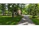 Long winding driveway through mature trees leading to a beautiful home at 820 Kenmore Rd, Chapel Hill, NC 27514