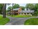 Expansive estate home featuring mature trees, manicured lawn, and circular driveway at 820 Kenmore Rd, Chapel Hill, NC 27514