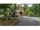 Long winding driveway leads to a home with a detached garage and ample parking space at 820 Kenmore Rd, Chapel Hill, NC 27514