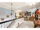Spacious hallway showcasing staircase and a glimpse into the adjacent living spaces with elegant lighting at 820 Kenmore Rd, Chapel Hill, NC 27514