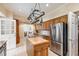 Classic kitchen with wood cabinets, a butcher block island, stainless steel appliances, and neutral countertops at 820 Kenmore Rd, Chapel Hill, NC 27514