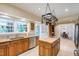 Well-lit kitchen with wood cabinets, an island with butcher block countertop, and stainless steel appliances at 820 Kenmore Rd, Chapel Hill, NC 27514
