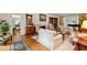 Spacious living room with a fireplace, hardwood floors, comfortable seating, and plenty of natural light, ideal for gatherings at 820 Kenmore Rd, Chapel Hill, NC 27514
