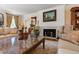 Beautiful living room with a fireplace and a decorative marble-topped coffee table at 820 Kenmore Rd, Chapel Hill, NC 27514
