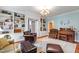 Inviting living room with built-in bookshelves, comfortable seating, and a stylish chandelier, perfect for relaxing and entertaining at 820 Kenmore Rd, Chapel Hill, NC 27514