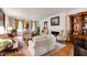 Bright living room with hardwood floors, fireplace, elegant sofas, and plenty of natural light for a warm and inviting space at 820 Kenmore Rd, Chapel Hill, NC 27514