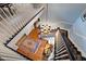 A grand staircase with black and white railings, hardwood floors, and a stunning chandelier at 820 Kenmore Rd, Chapel Hill, NC 27514