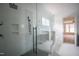 Spa-like bathroom featuring a frameless glass shower and dual sink vanity at 913 Harrison Ridge Rd, Wake Forest, NC 27587