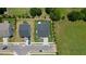Aerial view of homes featuring well-manicured lawns, driveways, and neighborhood streets at 10 Forest Brook Way, Clayton, NC 27520