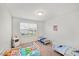 Bright bedroom featuring three beds, carpeted floor, and playful star-themed decor at 10 Forest Brook Way, Clayton, NC 27520