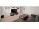 Comfortable living room with a large entertainment center, plush seating, and stylish decor at 10 Forest Brook Way, Clayton, NC 27520