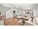 Living room boasts an open concept floor plan and L-shaped couch and hardwood floors at 10 Forest Brook Way, Clayton, NC 27520
