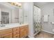 Bathroom featuring a double vanity, large mirror, decorative shower curtain, and tile flooring at 1003 Burnt Hickory Ct, Apex, NC 27502