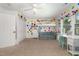Colorful bedroom with a lofted bed, comfortable seating, and a well-lit workspace at 1003 Burnt Hickory Ct, Apex, NC 27502