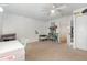 Bright bedroom with a desk, bookcase, neutral walls, and carpet flooring creating a comfortable space at 1003 Burnt Hickory Ct, Apex, NC 27502