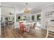 Sunlit dining area featuring a table with mismatched chairs and easy access to the deck at 1003 Burnt Hickory Ct, Apex, NC 27502