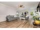 Bright living room featuring a fireplace, hardwood floors, and neutral color palette at 1003 Burnt Hickory Ct, Apex, NC 27502