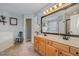 Primary bath offers dual sinks, a soaking tub, and neutral tile at 1003 Burnt Hickory Ct, Apex, NC 27502