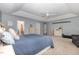 The primary bedroom features a trey ceiling and natural light at 1003 Burnt Hickory Ct, Apex, NC 27502