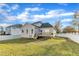A spacious backyard with a deck, a house, and a well-maintained lawn at 10603 Friendly Neighbor Ln, Raleigh, NC 27614