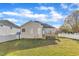 Backyard featuring a well-maintained lawn and a house with a cozy deck at 10603 Friendly Neighbor Ln, Raleigh, NC 27614