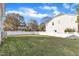 A green backyard with a well-kept lawn and a white privacy fence around the property at 10603 Friendly Neighbor Ln, Raleigh, NC 27614