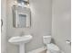 Bathroom with a modern sink and a white toilet for basic hygiene at 10603 Friendly Neighbor Ln, Raleigh, NC 27614