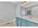 Bathroom featuring double sinks with a bright mirror and an open toilet at 10603 Friendly Neighbor Ln, Raleigh, NC 27614