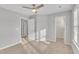 Spacious bedroom with neutral walls and carpet, featuring closet and bathroom access at 10603 Friendly Neighbor Ln, Raleigh, NC 27614
