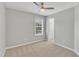 Bright bedroom with ceiling fan and natural light, creating a serene and inviting atmosphere at 10603 Friendly Neighbor Ln, Raleigh, NC 27614