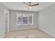 Bright bedroom with large windows offering a view of the neighborhood at 10603 Friendly Neighbor Ln, Raleigh, NC 27614