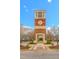 Beautiful brick Bedford clock tower with archway, landscaping and a brick walkway at 10603 Friendly Neighbor Ln, Raleigh, NC 27614