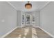 Dining area featuring a bay window letting in natural light, and a decorative chandelier at 10603 Friendly Neighbor Ln, Raleigh, NC 27614