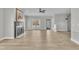 Expansive living room featuring a cozy fireplace, ceiling fan, and a sunlit window at 10603 Friendly Neighbor Ln, Raleigh, NC 27614
