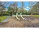 Community playground slides with stair access and wood chip surface at 10603 Friendly Neighbor Ln, Raleigh, NC 27614