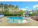 Community kiddie pool area with water features and a slide, perfect for families at 10603 Friendly Neighbor Ln, Raleigh, NC 27614