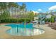 Community kiddie pool area with water features and a slide, perfect for families at 10603 Friendly Neighbor Ln, Raleigh, NC 27614