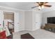 Bonus room with neutral walls and carpet, a ceiling fan, and a view to the stairs and hallway at 107 Trackimire Ln, Apex, NC 27539
