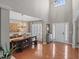 Elegant dining area featuring hardwood floors, ample natural light, and modern chandelier at 107 Trackimire Ln, Apex, NC 27539