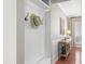 Welcoming entryway with coat hooks, bench, and console table perfect for coming home at 107 Trackimire Ln, Apex, NC 27539
