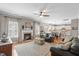 Inviting living room featuring a fireplace, hardwood floors, and an open floor plan at 107 Trackimire Ln, Apex, NC 27539