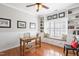 Bright home office featuring custom built-ins, natural light, and hardwood floors at 107 Trackimire Ln, Apex, NC 27539