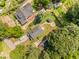 An aerial view shows the home's roof, backyard with green lawn, and surrounding trees at 109 St Marys St, Garner, NC 27529